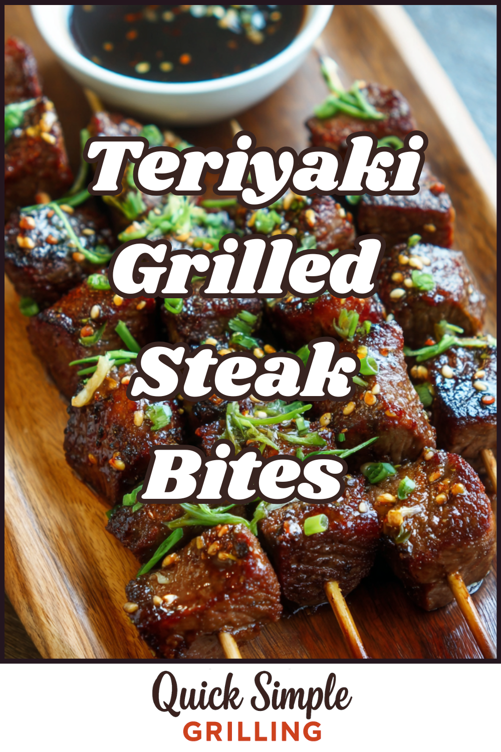 Teriyaki Grilled Steak Bites skewers glazed with teriyaki sauce, garnished with herbs, served on a wooden plate alongside a small bowl of dipping sauce.